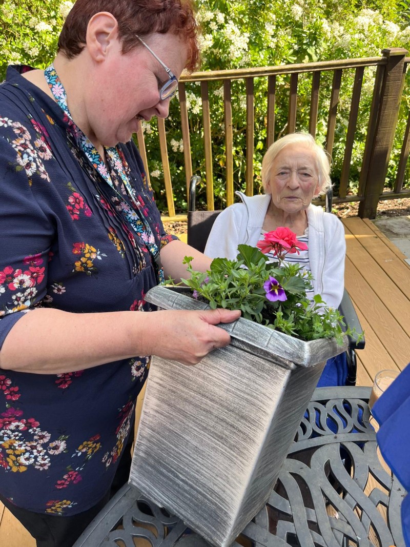 Betty doesn't look impressed but she dose really love being in the garden.